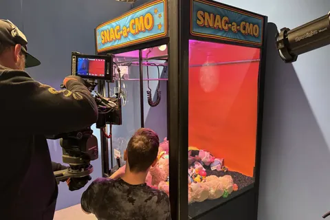 Filming a claw machine called Snag-a-CMO