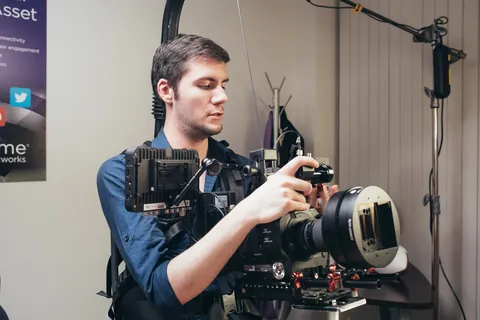 A camera operator with a cinema camera on a stabilizer rig