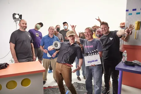 Cast and crew hamming it up with the Goodcall slate