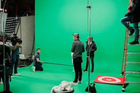 The crew on a green-screen stage